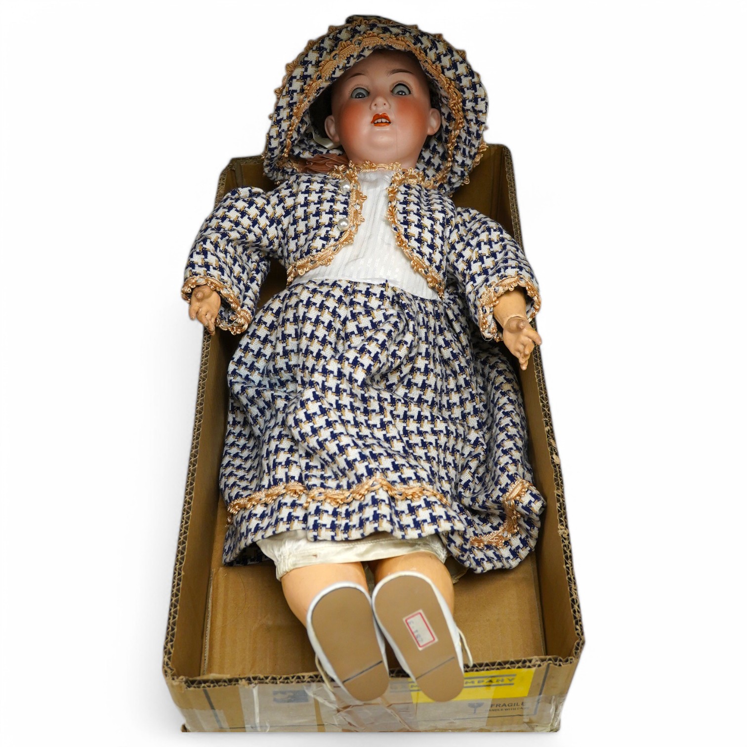 A stamped, Trebor Germany 22, bisque headed, open mouthed doll. 60cm long. Condition - fair to good